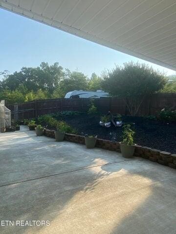 view of patio featuring an outdoor structure