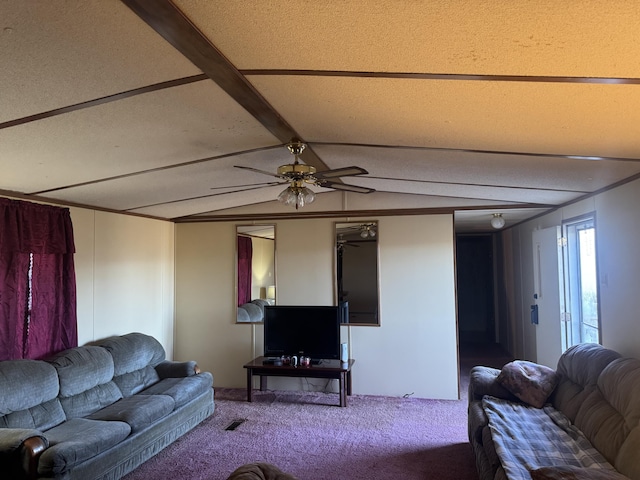 living room featuring beamed ceiling, carpet flooring, and ceiling fan