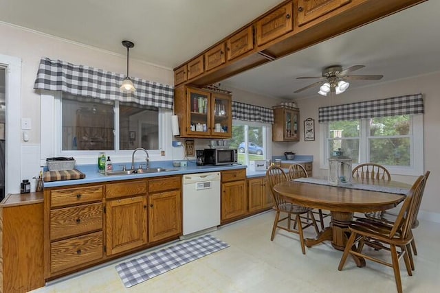 229 Plerce Hill St, Spring City, TN 37381 - kitchen with white dishwasher, a sink, brown cabinets, and stainless steel microwave