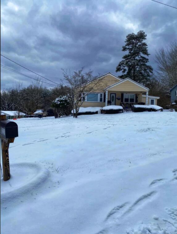 229 Plerce Hill St, Spring City, TN 37381 - yard covered in snow with covered porch