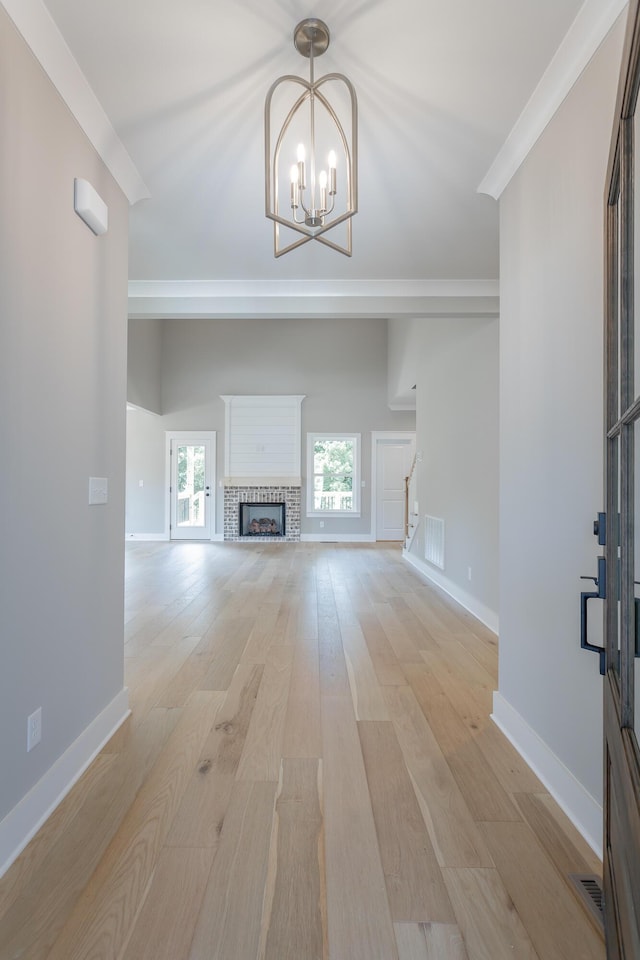 5118 Judd Way NW Unit 21, Cleveland, TN 37312 - unfurnished living room featuring stairway, a chandelier, light wood-type flooring, and baseboards