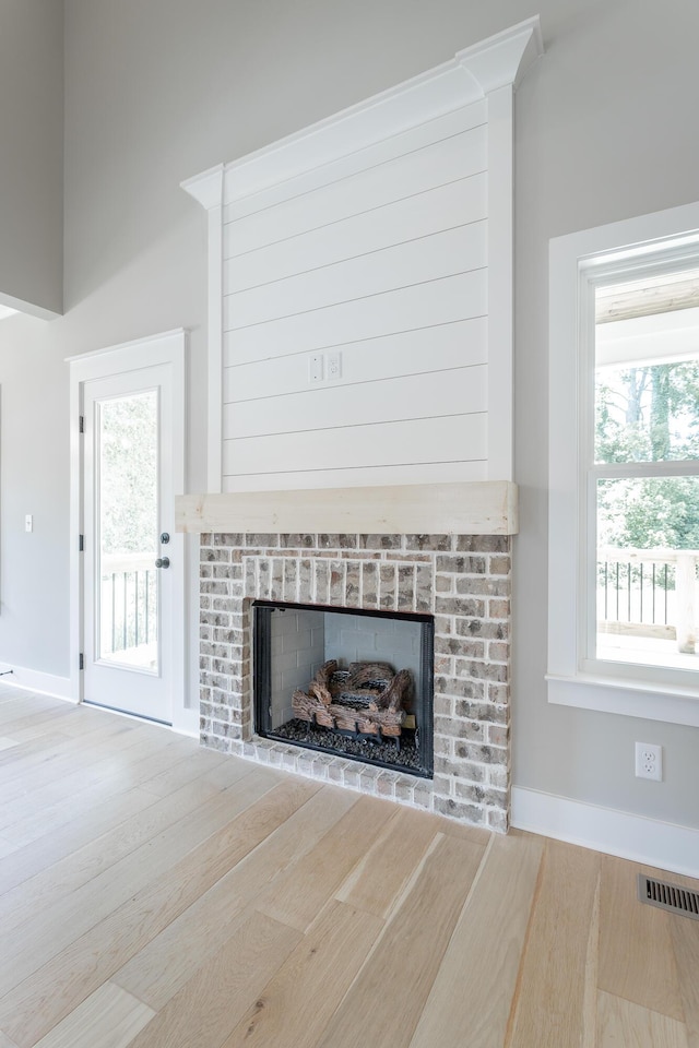 5118 Judd Way NW Unit 21, Cleveland, TN 37312 - detailed view of a brick fireplace, baseboards, and wood finished floors