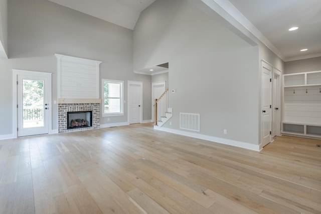 5118 Judd Way NW Unit 21, Cleveland, TN 37312 - unfurnished living room with light wood finished floors, baseboards, stairs, recessed lighting, and high vaulted ceiling