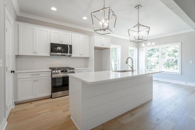 5118 Judd Way NW Unit 21, Cleveland, TN 37312 - kitchen featuring appliances with stainless steel finishes, a sink, a chandelier, tasteful backsplash, and white cabinets