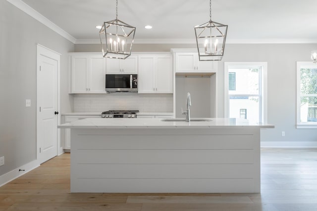 5118 Judd Way NW Unit 21, Cleveland, TN 37312 - kitchen with stainless steel microwave, a sink, a chandelier, ornamental molding, and recessed lighting
