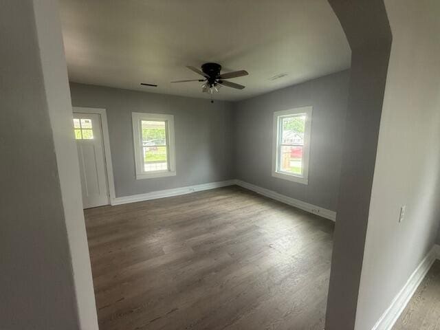 1220 Hardwick St SE, Cleveland, TN 37311 - spare room with plenty of natural light, ceiling fan, arched walkways, and wood finished floors
