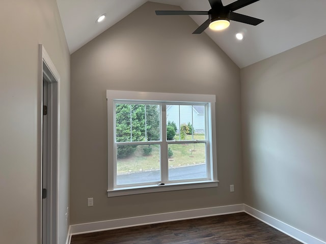 unfurnished room with high vaulted ceiling, ceiling fan, and dark wood-type flooring