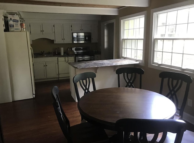 14318 Bluffview Dr, Birchwood, TN 37308 - dining room with dark wood finished floors and beamed ceiling