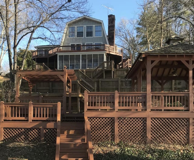 14318 Bluffview Dr, Birchwood, TN 37308 - back of property featuring stairway, a chimney, a wooden deck, and a gazebo