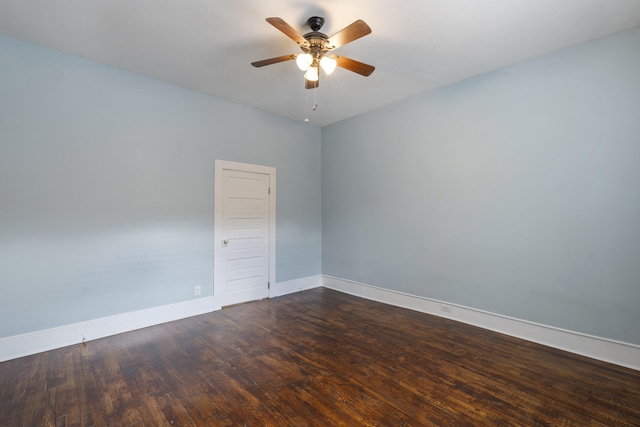 unfurnished room featuring ceiling fan and dark hardwood / wood-style floors