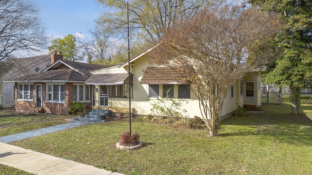 view of front of home with a front yard