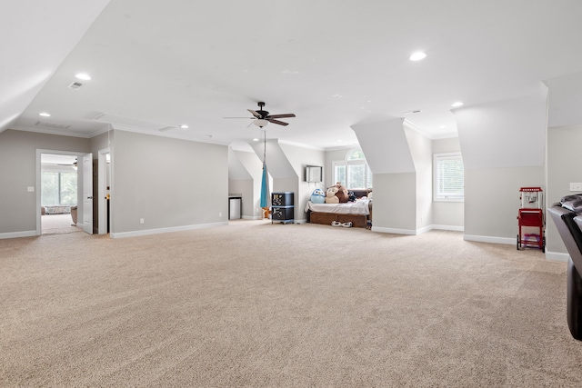 interior space with ceiling fan, plenty of natural light, and ornamental molding