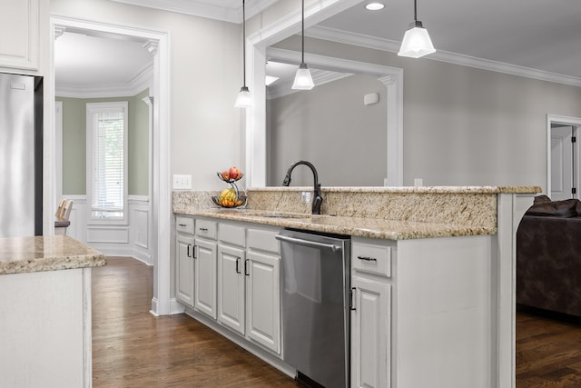 kitchen featuring sink, appliances with stainless steel finishes, decorative light fixtures, white cabinets, and ornamental molding