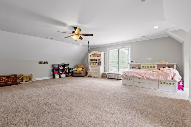 unfurnished bedroom featuring carpet flooring, vaulted ceiling, ceiling fan, and crown molding