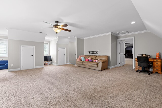 interior space with carpet flooring, ceiling fan, lofted ceiling, and crown molding