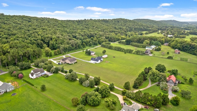 birds eye view of property with a rural view