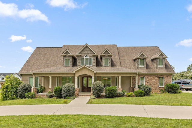 view of front facade with a porch and a front yard