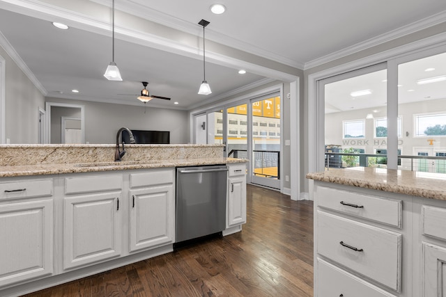 kitchen featuring dishwasher, white cabinets, sink, dark hardwood / wood-style floors, and decorative light fixtures