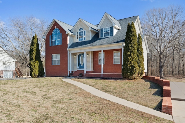 view of front of property with a porch and a front yard