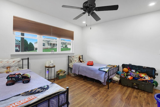 bedroom featuring ceiling fan and hardwood / wood-style flooring