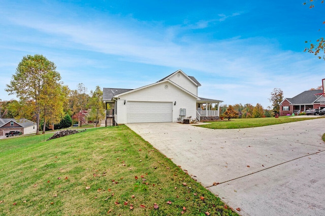 view of front facade with a front yard and a garage