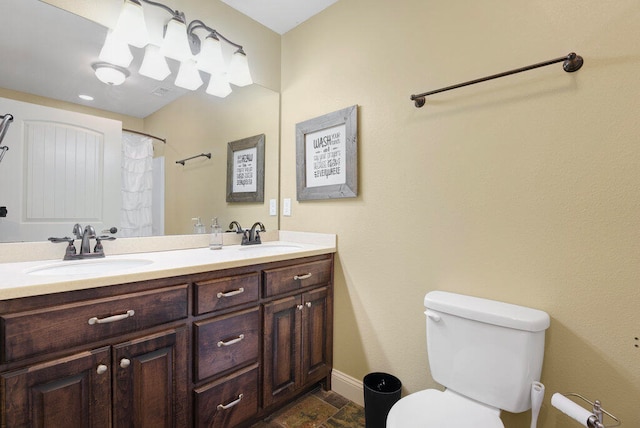 bathroom with a shower with shower curtain, vanity, and toilet