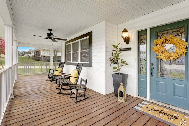 wooden deck with ceiling fan