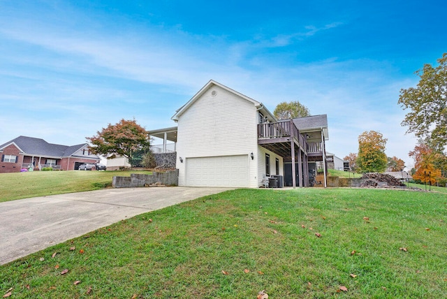 view of front property with a garage, central air condition unit, and a front lawn