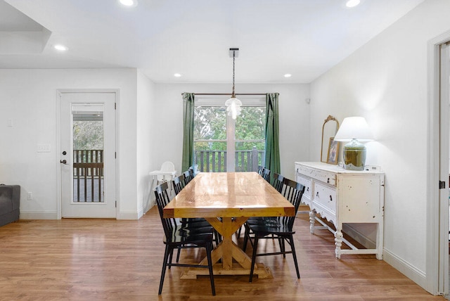 dining space featuring a wealth of natural light and light hardwood / wood-style flooring