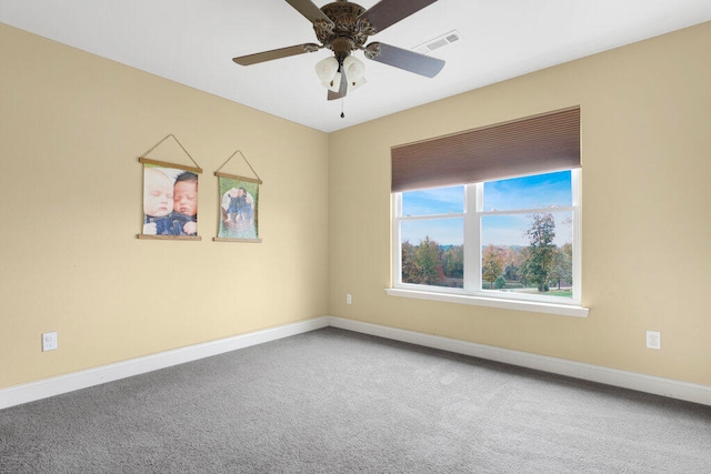 carpeted empty room featuring ceiling fan