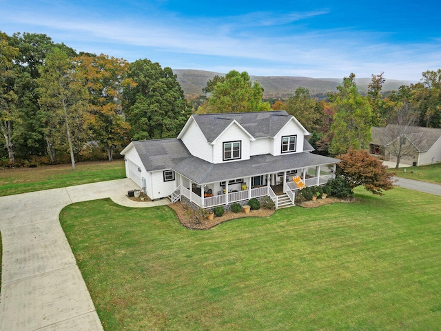 view of front of house with covered porch and a front yard