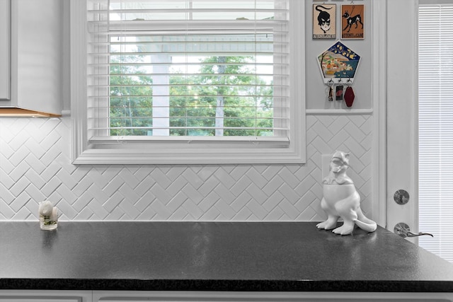 5086 Oop Rd, Chattanooga, TN 37416 - kitchen view of dark countertops, white cabinetry, and decorative backsplash