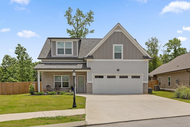 5086 Oop Rd, Chattanooga, TN 37416 - craftsman-style home featuring brick siding, board and batten siding, driveway, a garage, and central air condition unit