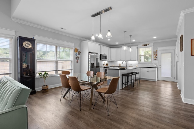 5086 Oop Rd, Chattanooga, TN 37416 - dining space featuring plenty of natural light, ornamental molding, dark wood-style flooring, baseboards, and recessed lighting