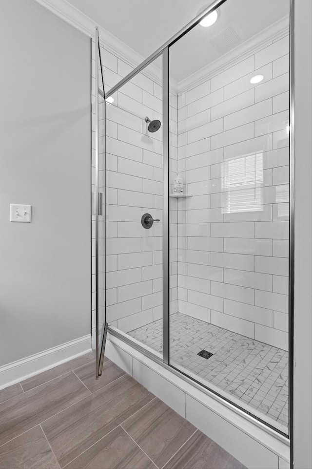 5086 Oop Rd, Chattanooga, TN 37416 - full bathroom featuring crown molding, a stall shower, baseboards, and wood finished floors