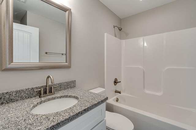 full bathroom with shower / bathing tub combination, vanity, and toilet