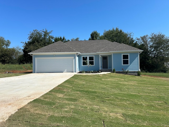 ranch-style house with a front yard and a garage