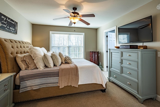 bedroom featuring a ceiling fan and light colored carpet