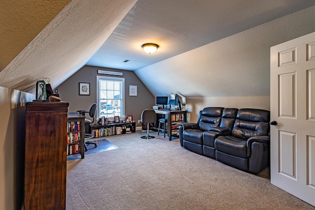 office space featuring vaulted ceiling, carpet floors, and a textured ceiling