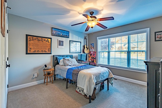 bedroom featuring a ceiling fan, baseboards, and carpet floors