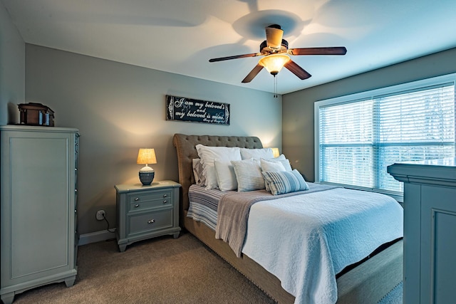 bedroom featuring baseboards, light carpet, and a ceiling fan