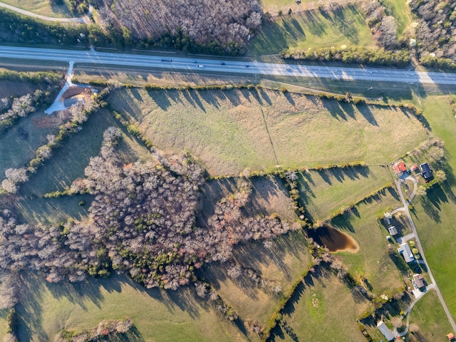 birds eye view of property featuring a rural view