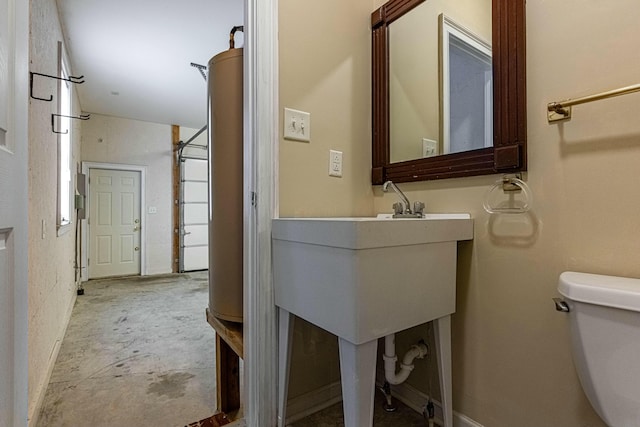 bathroom with toilet and concrete floors