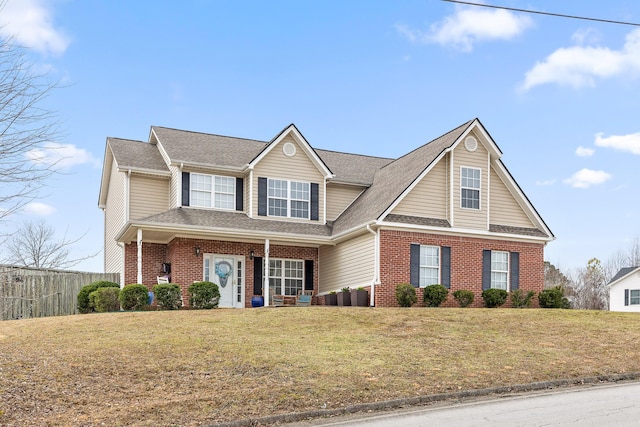 view of front of property featuring a front lawn and a porch