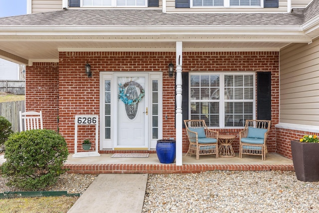 property entrance with covered porch