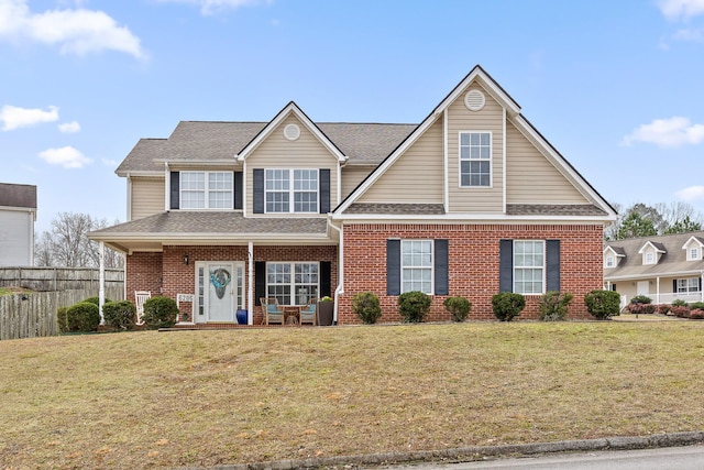 view of front of home with a front lawn and a porch