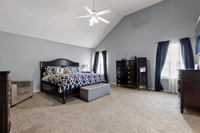 carpeted bedroom featuring high vaulted ceiling and ceiling fan