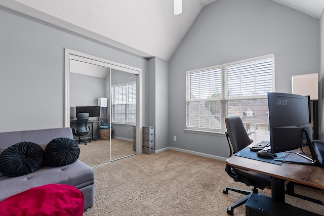 office featuring vaulted ceiling and carpet