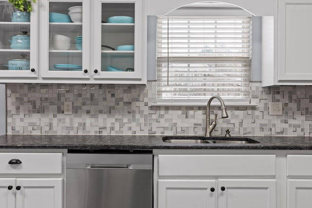 kitchen with dishwasher, sink, decorative backsplash, and white cabinets