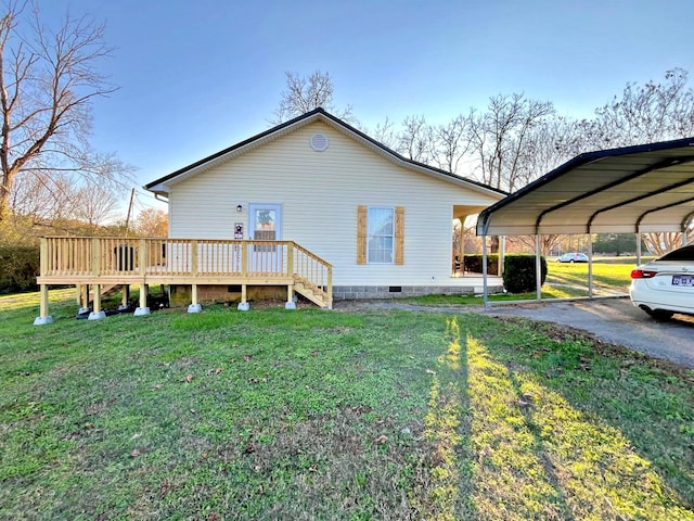 view of home's exterior featuring a carport, a deck, and a lawn